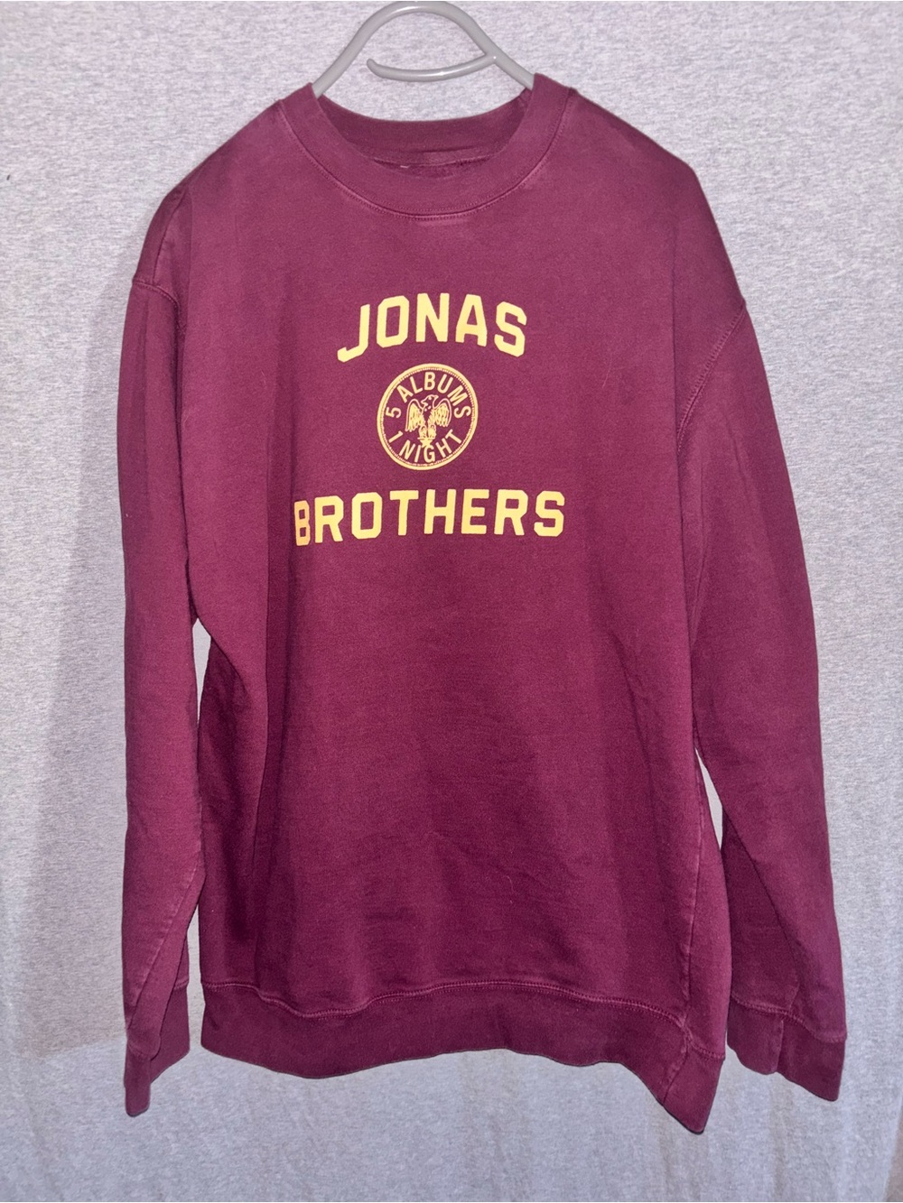 Jonas Brothers Maroon Graphic Crewneck Sweatshirt with Yellow Lettering